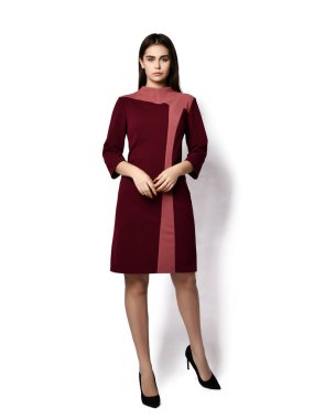 Young beautiful brunette curly smiling woman model in dark pink stripe stylish evening midi dress and shoes standing