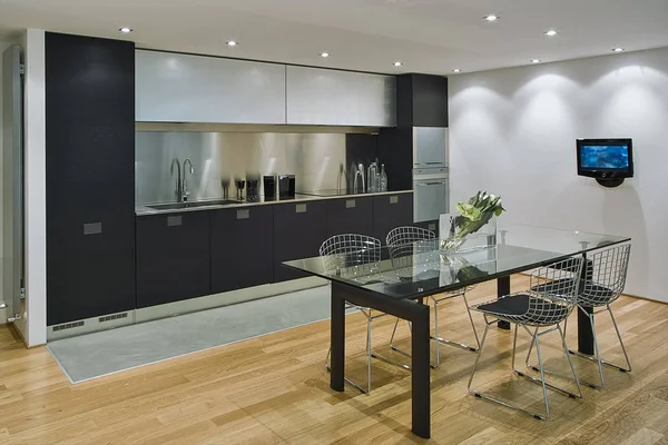 interiors shots of a modern kitchen in the foreground the glass