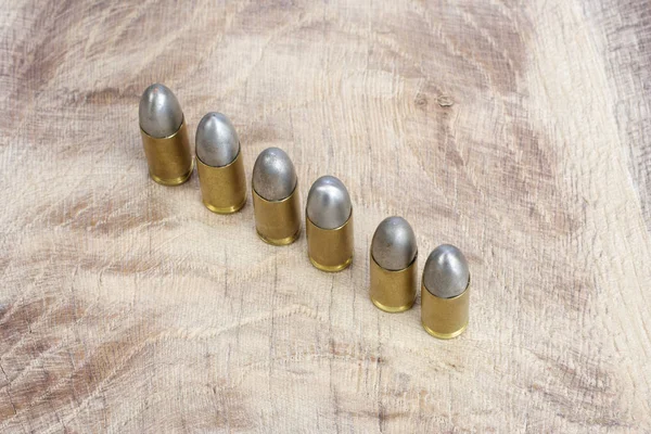 9Mm Caliber Cartridge Wooden Background — Stock Photo, Image