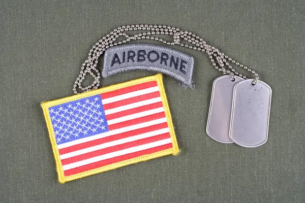 KIEV, UKRAINE - August 21, 2015. US ARMY airborne tab with dog tag and flag patch on olive green uniform — Stock Photo, Image