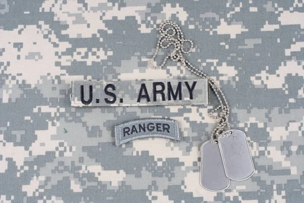 KIEV, UKRAINE - August 21, 2015. US ARMY ranger tab with dog tag on camouflage uniform — Stock Photo, Image