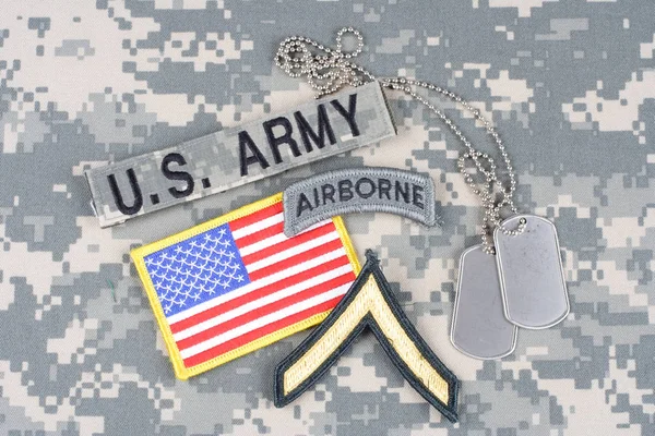 KIEV, UKRAINE - August 21, 2015. US ARMY Private rank patch, airborne tab, flag patch,  with dog tag on camouflage uniform — Stock Photo, Image