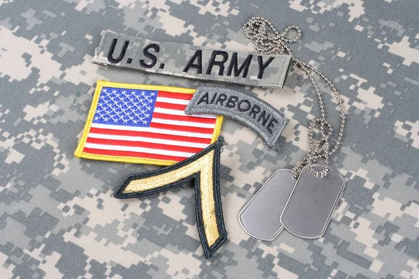 KIEV, UKRAINE - August 21, 2015. US ARMY Private rank patch, airborne tab, flag patch,  with dog tag on camouflage uniform — Stock Photo, Image