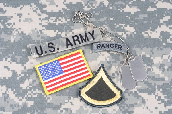 KIEV, UKRAINE - August 21, 2015. US ARMY Private First Class rank patch, ranger tab, flag patch,  with dog tag on camouflage uniform — Stock Photo, Image