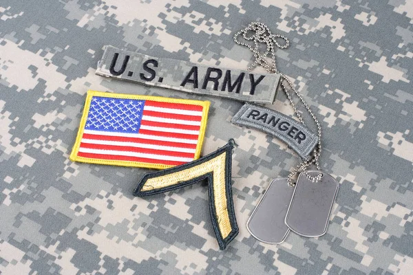 KIEV, UKRAINE - August 21, 2015. US ARMY Private rank patch, ranger tab, flag patch,  with dog tag on camouflage uniform — Stock Photo, Image