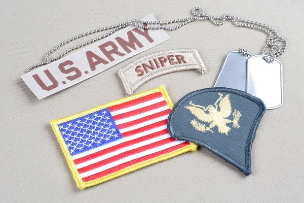 KIEV, UKRAINE - August 21, 2015.  US ARMY Specialist rank patch, sniper tab, flag patch and dog tag — Stock Photo, Image