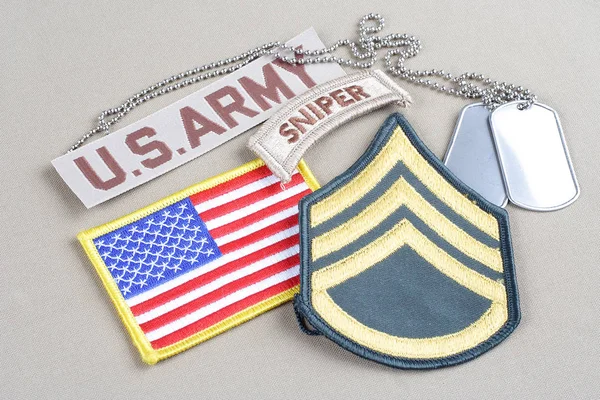 KIEV, UKRAINE - August 21, 2015.  US ARMY Staff Sergeant rank patch, sniper tab, flag patch and dog tag — Stock Photo, Image