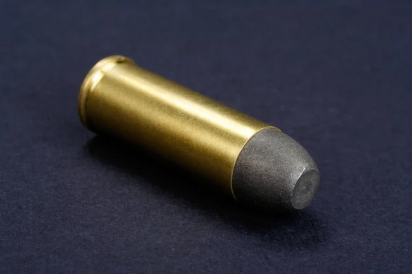 The .45 Revolver cartridge dating to 1872 on black background