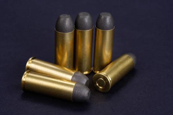 The .45 Revolver cartridges dating to 1872 on black background — Stock Photo, Image