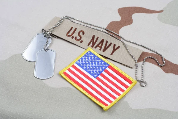 KIEV, UKRAINE - May 9, 2015. US NAVY branch tape with dog tags and US flag patch on desert camouflage uniform — Stock Photo, Image