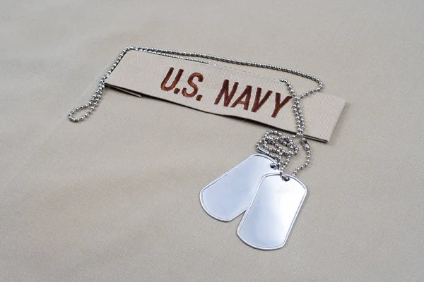 KIEV, UKRAINE - May 9, 2015. US NAVY branch tape with dog tags on desert camouflage uniform — Stock Photo, Image