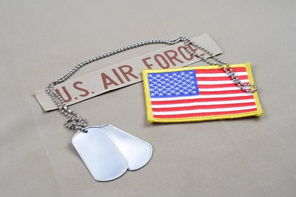 KIEV, UKRAINE - May 9, 2015. US AIR FORCE branch tape with dog tags and US flag patch on desert camouflage uniform — Stock Photo, Image
