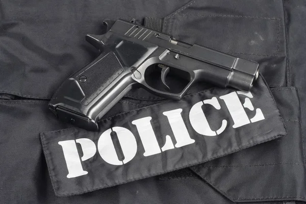 Концепция Полиции Пистолет Фоне Черной Униформы — стоковое фото