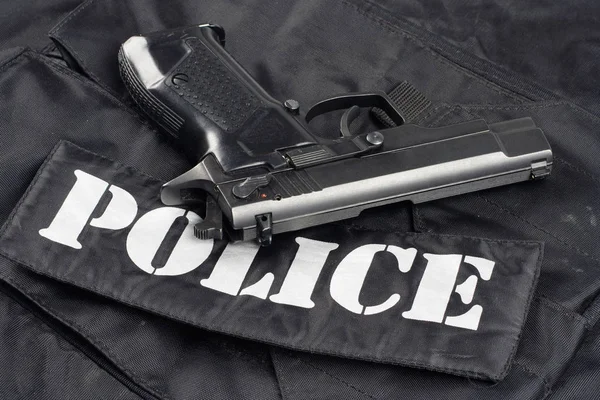 Pistola Sfondo Uniforme Nero Polizia — Foto Stock