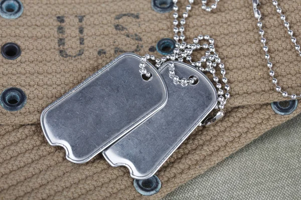 A pair of blank dog tags on U.S. Army uniform world war two era — Stock Photo, Image