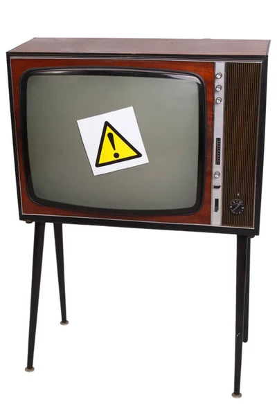 Vintage retro TV en blanco y negro con signo de atención amarillo — Foto de Stock