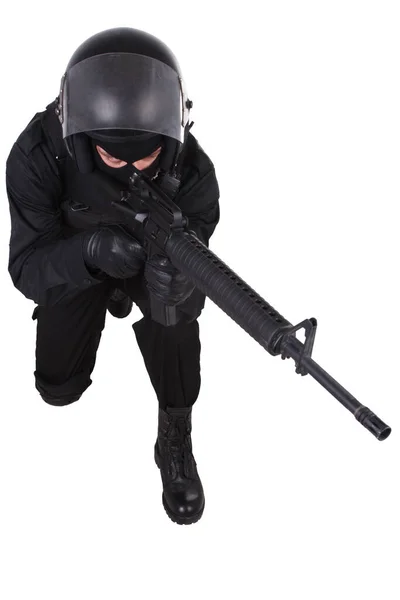 Riot police officer in black uniform with assault rifle — Stock Photo, Image