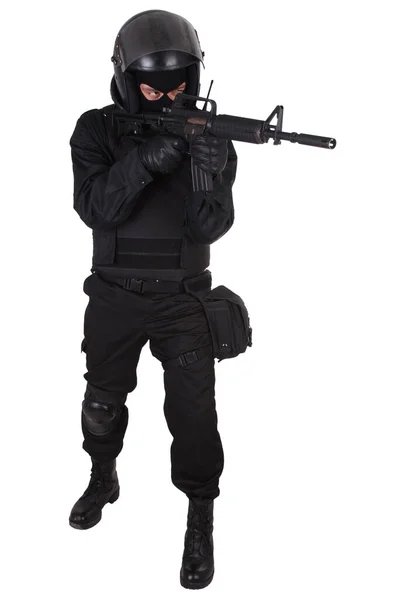 Riot police officer in black uniform with assault rifle — Stock Photo, Image
