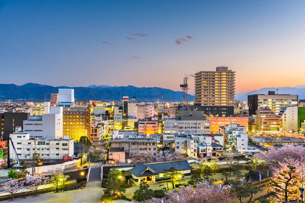 Kofu, Yamanashi, Japan downtown cityscape in springtime at dusk.