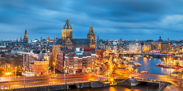 Amsterdam, Netherlands town cityscape over the Old Centre District with Basilica of Saint Nicholas.