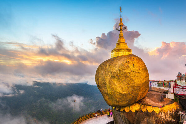 Golden Rock of Mt. Kyaiktiyo, Myanmar during a hazy sunset.