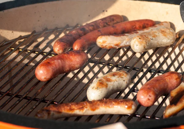 Grilled sausages during cooking — Stock Photo, Image