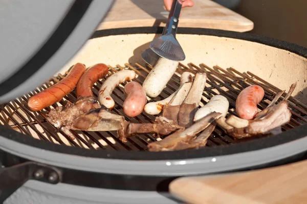 Grilled sausages during cooking — Stock Photo, Image