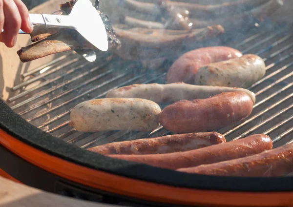 Grilled sausages during cooking — Stock Photo, Image