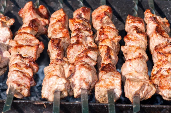 Skewers fried meat on a grill — Stock Photo, Image