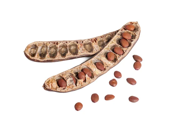 Carob opened with seeds isolated on white — Stock Photo, Image