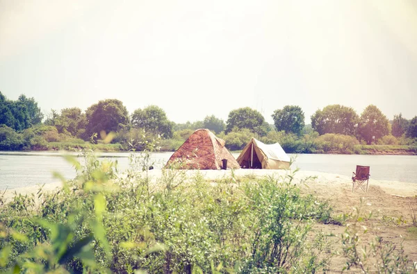 stock image Camping tent near the river in the summer