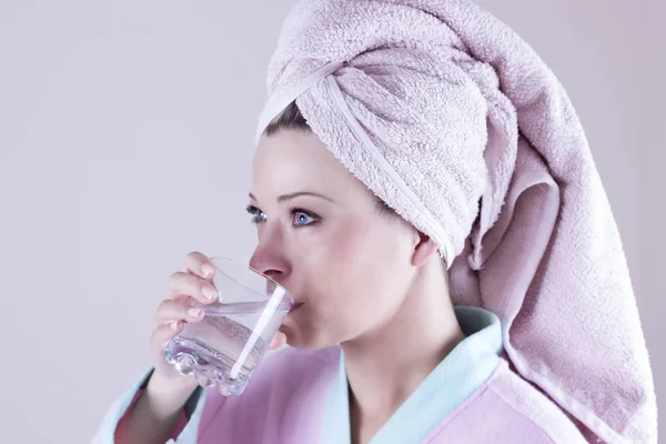 Face portrait of woman drinking water. Smiling girl. Isolated po Stock Image