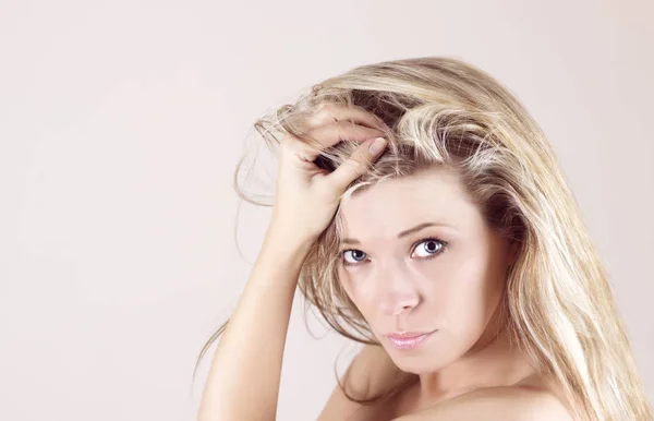 Portrait of sexy young woman with hand in hair Royalty Free Stock Images