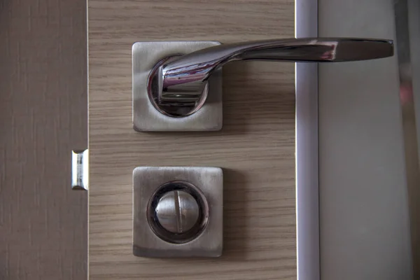 Door handle and lock on the door in the room close up. — Stock Photo, Image