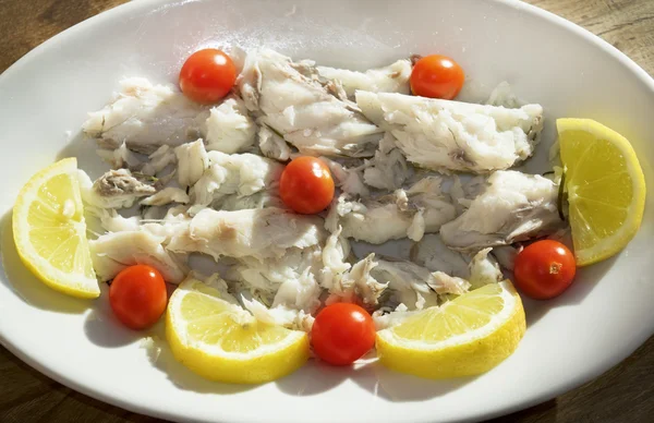 Grilled codfish with lemon and chery tomatoes salad — Stock Photo, Image