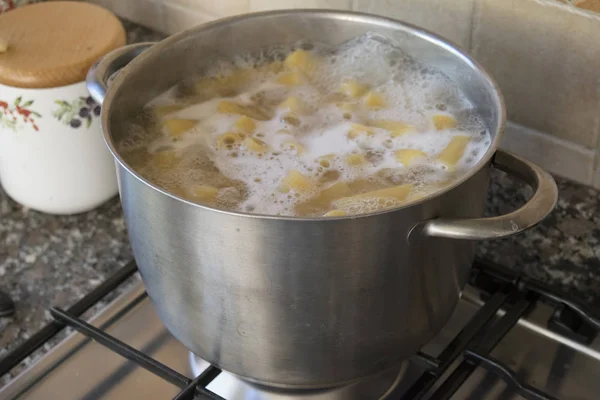 Cooking pasta in metallic pot — Stock Photo, Image