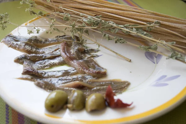 Stroncatura calabrese with anchovies and olives — Stock Photo, Image