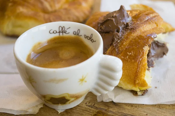 Espresso coffee and chocolate croissant — Stock Photo, Image