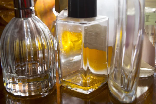 Perfume bottles in backlight — Stock Photo, Image
