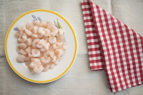 Frozen prawns in a white dish — Stock Photo, Image