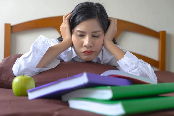 young woman concentrate reading book. girl learning writing homework. education assessment concept. Student studying college exam, doing homework at university. concentration on admissions in college.