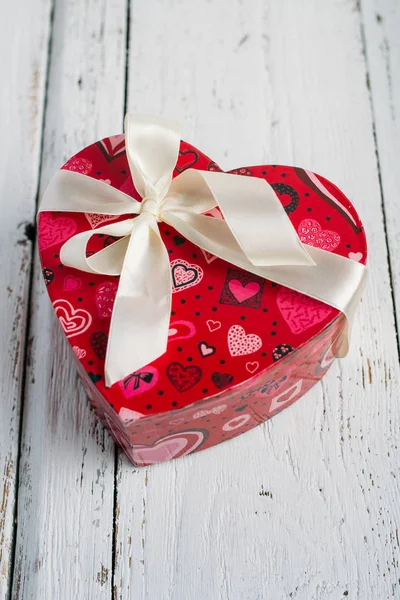 Box heart shaped on white table — Stock Photo, Image