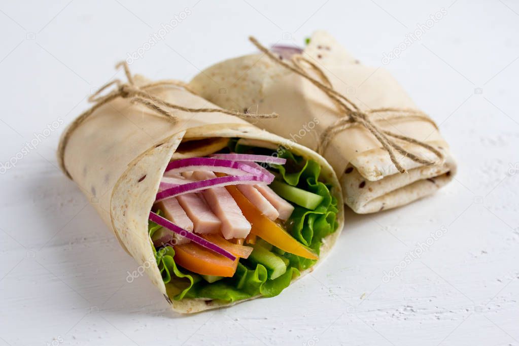 Homemade Burritos with vegetables, ham and tortilla