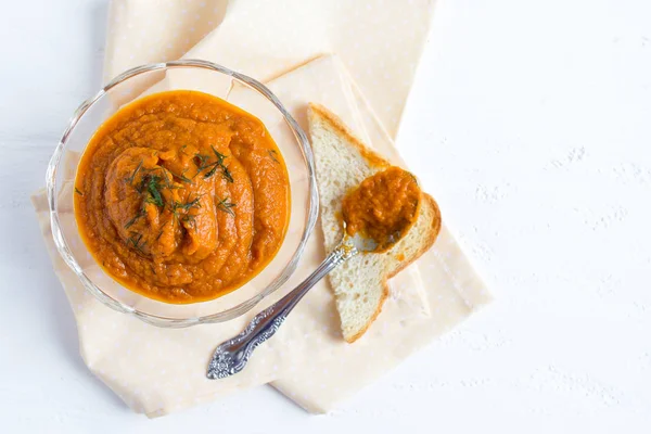 Toasted eggplant caviar on white wooden background