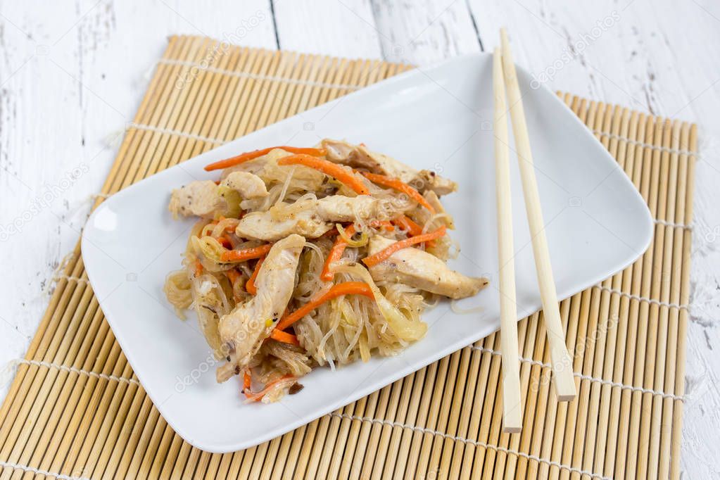 Chapchae - Asian dish of glass noodles with chicken and vegetabl