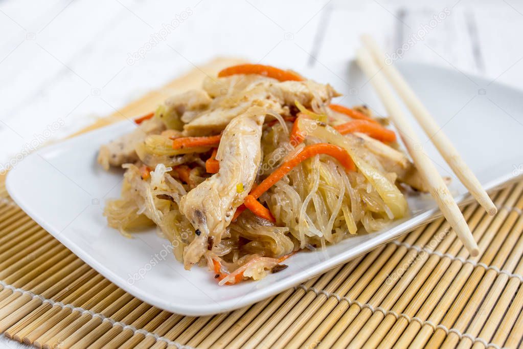 Chapchae - Asian dish of glass noodles with chicken and vegetabl