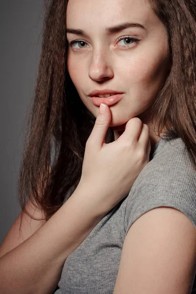 Portrait of young beautiful girl brunette in the Studio — Stock Photo, Image