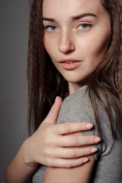 Portrait of young beautiful girl brunette in the Studio — Stock Photo, Image