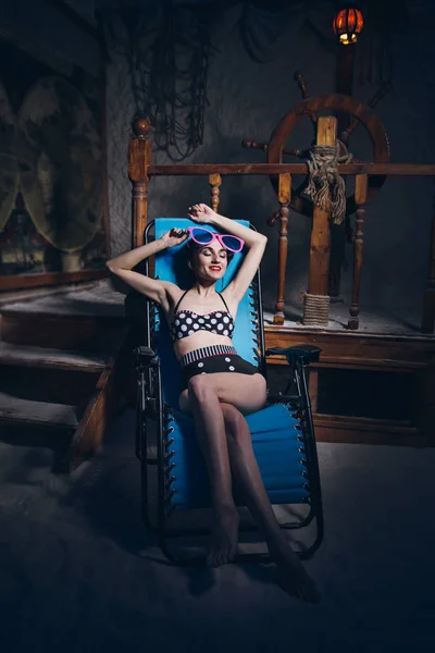 Woman in salt room in a bathing suit