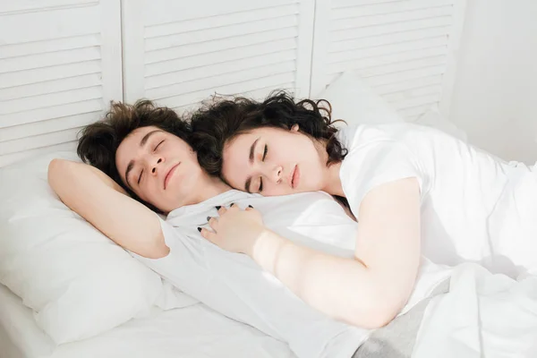 Couple in love sleeps cuddling in bed — Stock Photo, Image